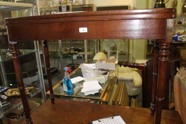 Appraisal: A VICTORIAN MAHOGANY FOLDOVER TOP CARD TABLE with inset baize