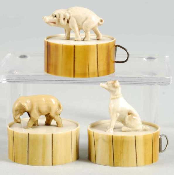 Appraisal: Lot of Figural Tape Measures Description Includes a miniature dog