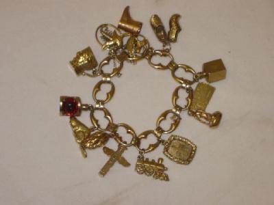 Appraisal: A CT GOLD CHARM BRACELET comprising large oval links hanging