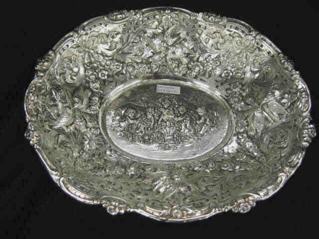 Appraisal: Elaborate Sterling Silver Oval Centerpiece Bowl cherubs or putti at