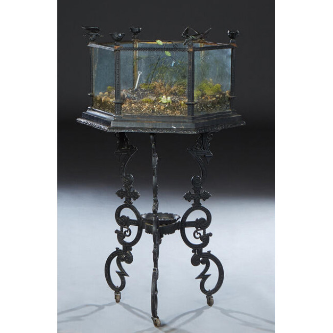 Appraisal: Cast Iron Terrarium c the hexagonal glass sided top on