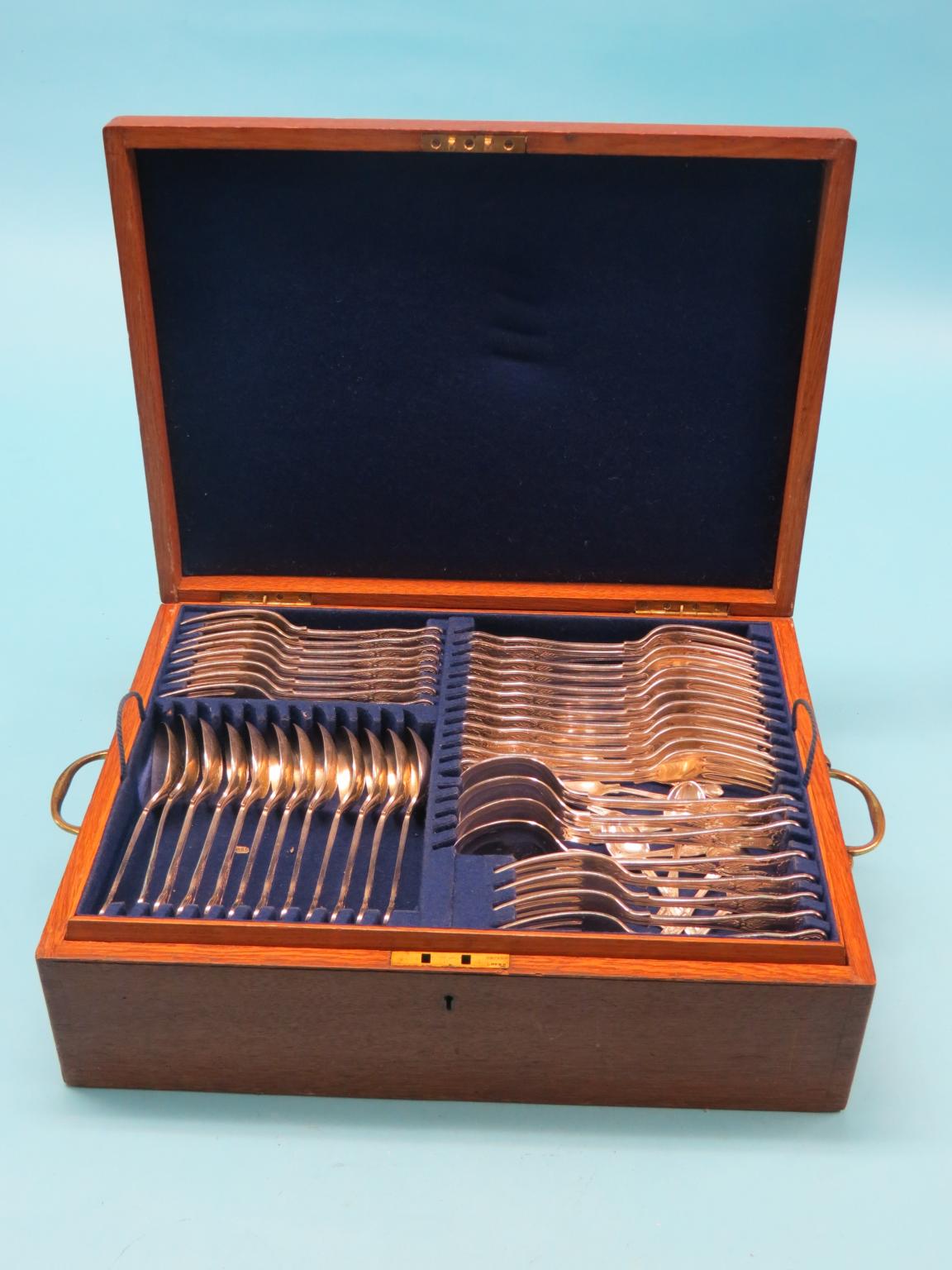 Appraisal: A canteen of silver plated cutlery King's pattern fitted oak