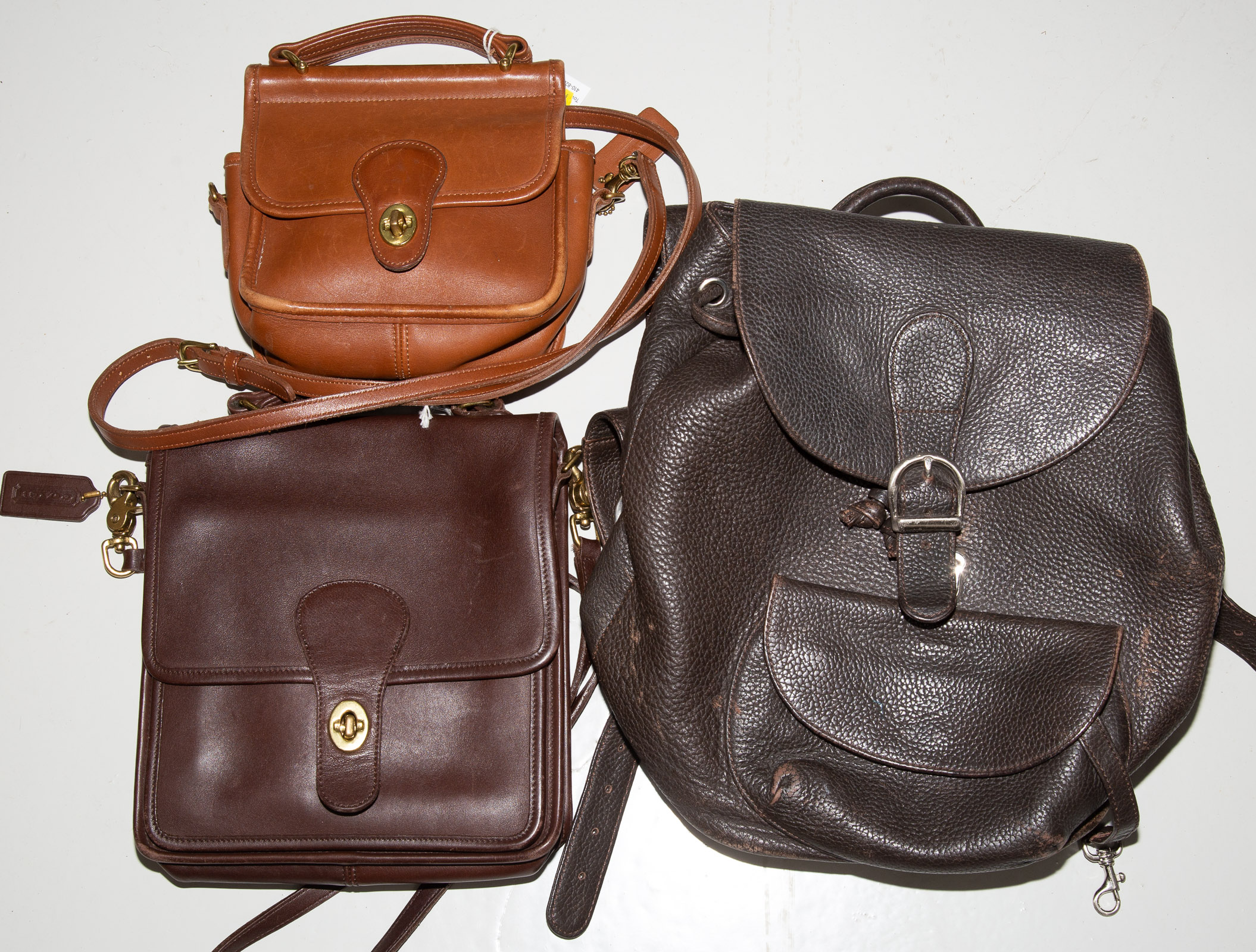 Appraisal: TWO COACH BAGS A LEATHER BACKPACK Featuring Chocolate brown leather