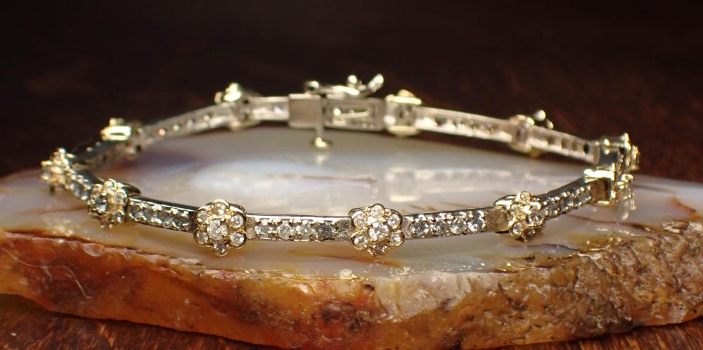 Appraisal: DIAMOND AND FOURTEEN KARAT GOLD BRACELET The yellow and white