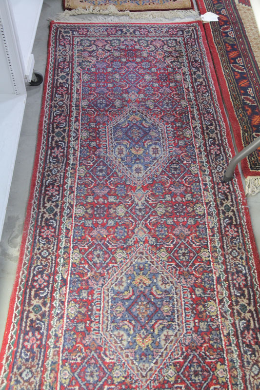 Appraisal: ORIENTAL STYLE RUNNER Red ground with intricate repeating floral and