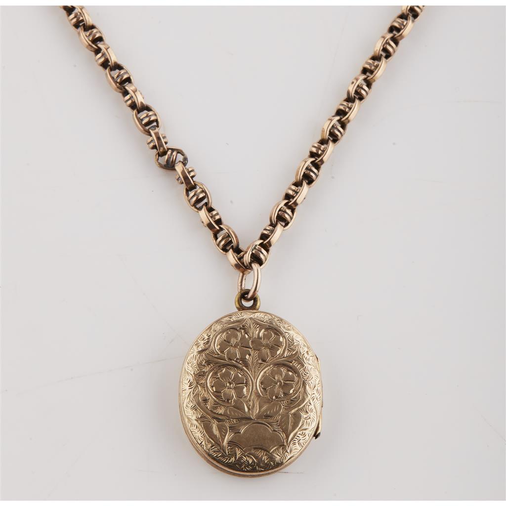 Appraisal: A locket and chain the oval locket with engraved foliate