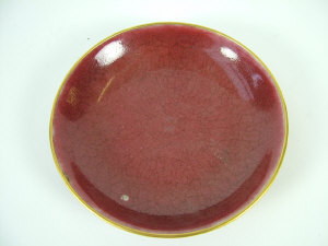 Appraisal: A Chinese sang de boeuf saucer dish of shallow circular