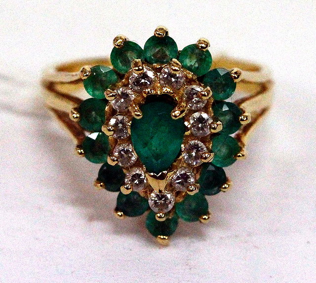 Appraisal: A GOLD COLOURED RING set with green and white stones