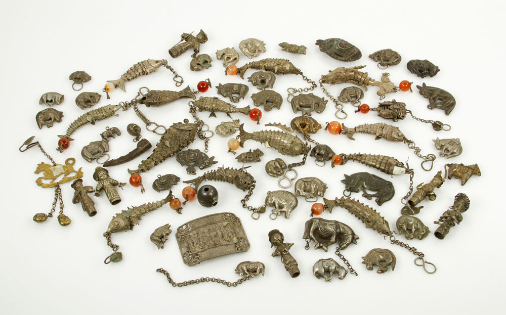 Appraisal: - Metal Ornaments from Southeast Asia Lot of approximately forty