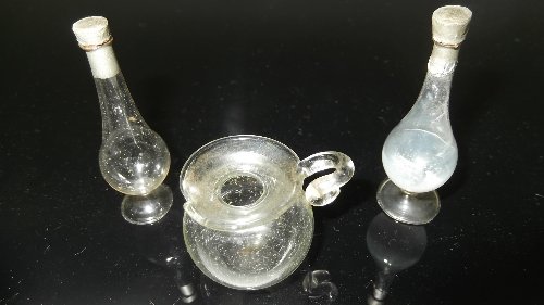 Appraisal: A blown glass jug with scroll handle and two glass