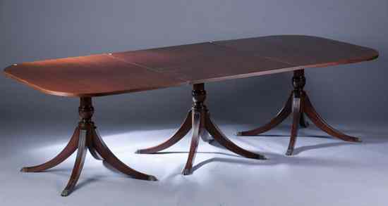 Appraisal: REGENCY STYLE MAHOGANY TRIPLE-PEDESTAL DINING TABLE Reeded edge rectangular top