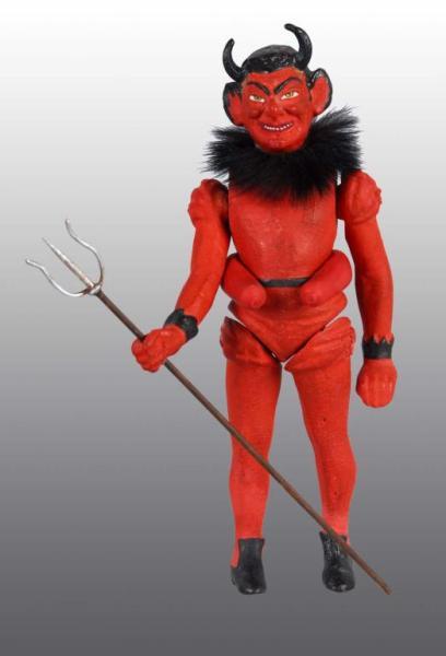 Appraisal: German Halloween Jointed Devil Candy Container Description Marked Germany on