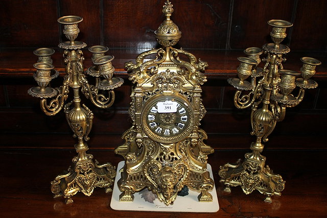 Appraisal: A TH CENTURY FRENCH BRASS CLOCK GARNITURE the clock with