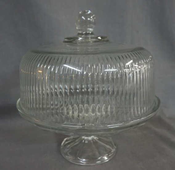 Appraisal: This is a vintage clear pressed glass cake plate -