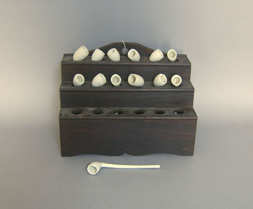 Appraisal: Oak pipe stand with clay pipes h x h