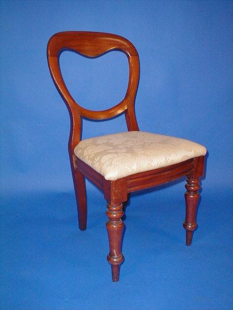 Appraisal: A set of four Victorian mahogany balloon back dining chairs