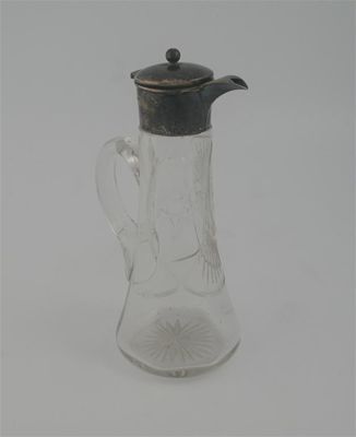 Appraisal: An Edwardian mounted cut glass claret jug with a flared