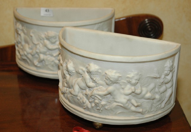 Appraisal: A PAIR OF CLASSICAL STYLE CERAMIC POTS Semi circular each