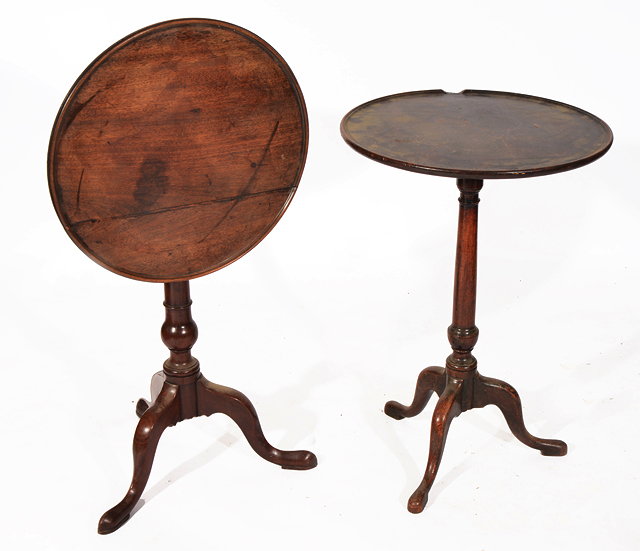 Appraisal: TWO MAHOGANY GEORGIAN CIRCULAR OCCASIONAL TABLES with dished tops turned