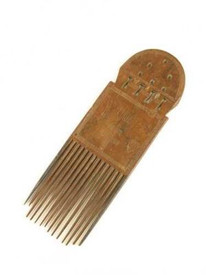 Appraisal: An Ashanti comb with pierced and incised decoration including birds