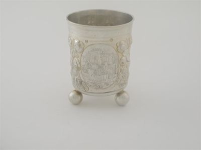 Appraisal: A late th century German embossed beaker on three ball