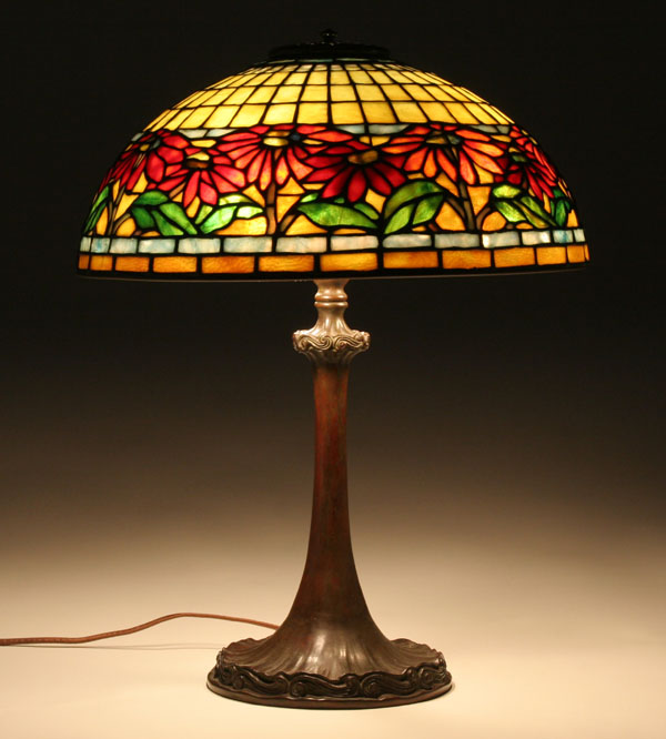 Appraisal: Leaded glass and bronze table lamp in the poinsettia pattern