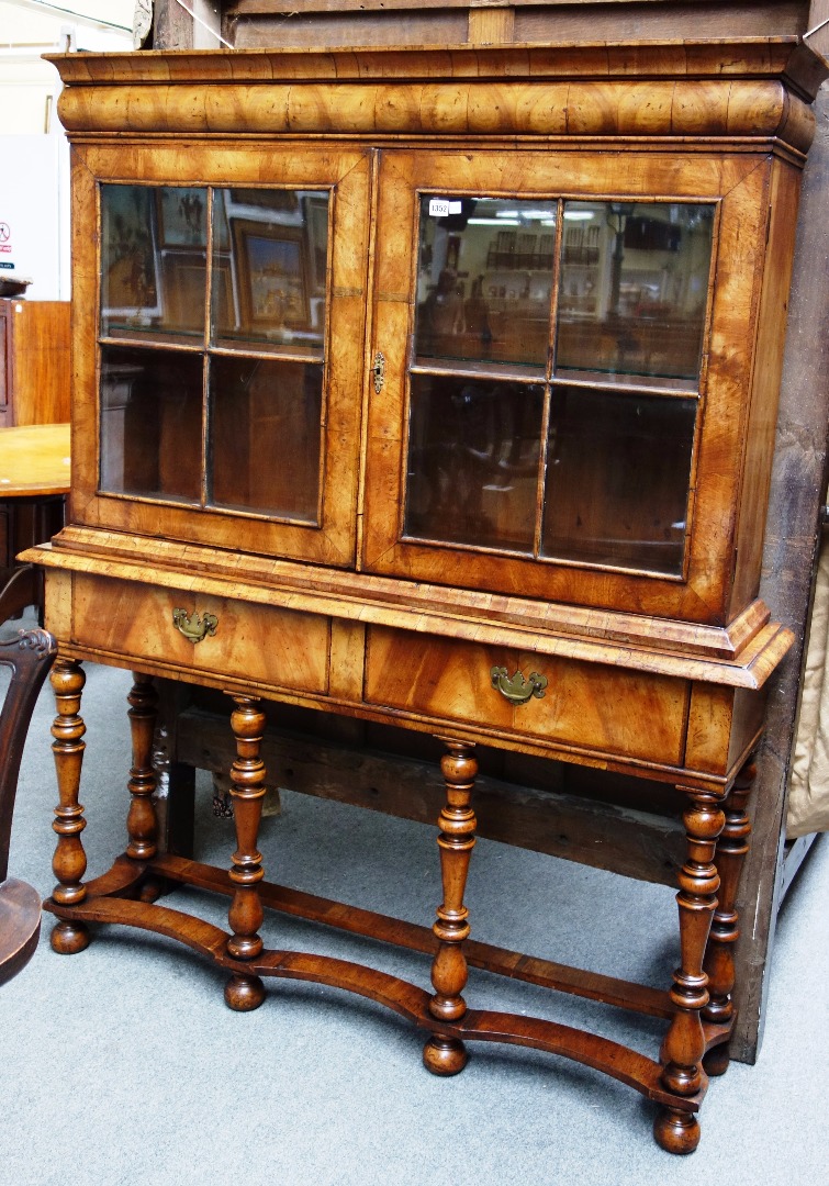 Appraisal: A Queen Anne style walnut cabinet on stand the pair