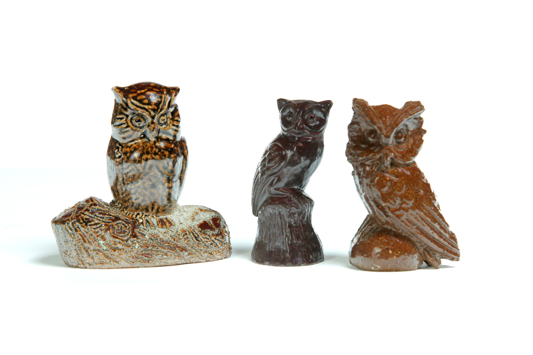 Appraisal: THREE AMERICAN SEWERTILE OWLS Twentieth century One on log possibly