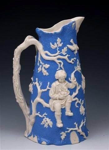 Appraisal: A SALT GLAZE RELIEF MOULDED JUG OF BLUE GROUND by