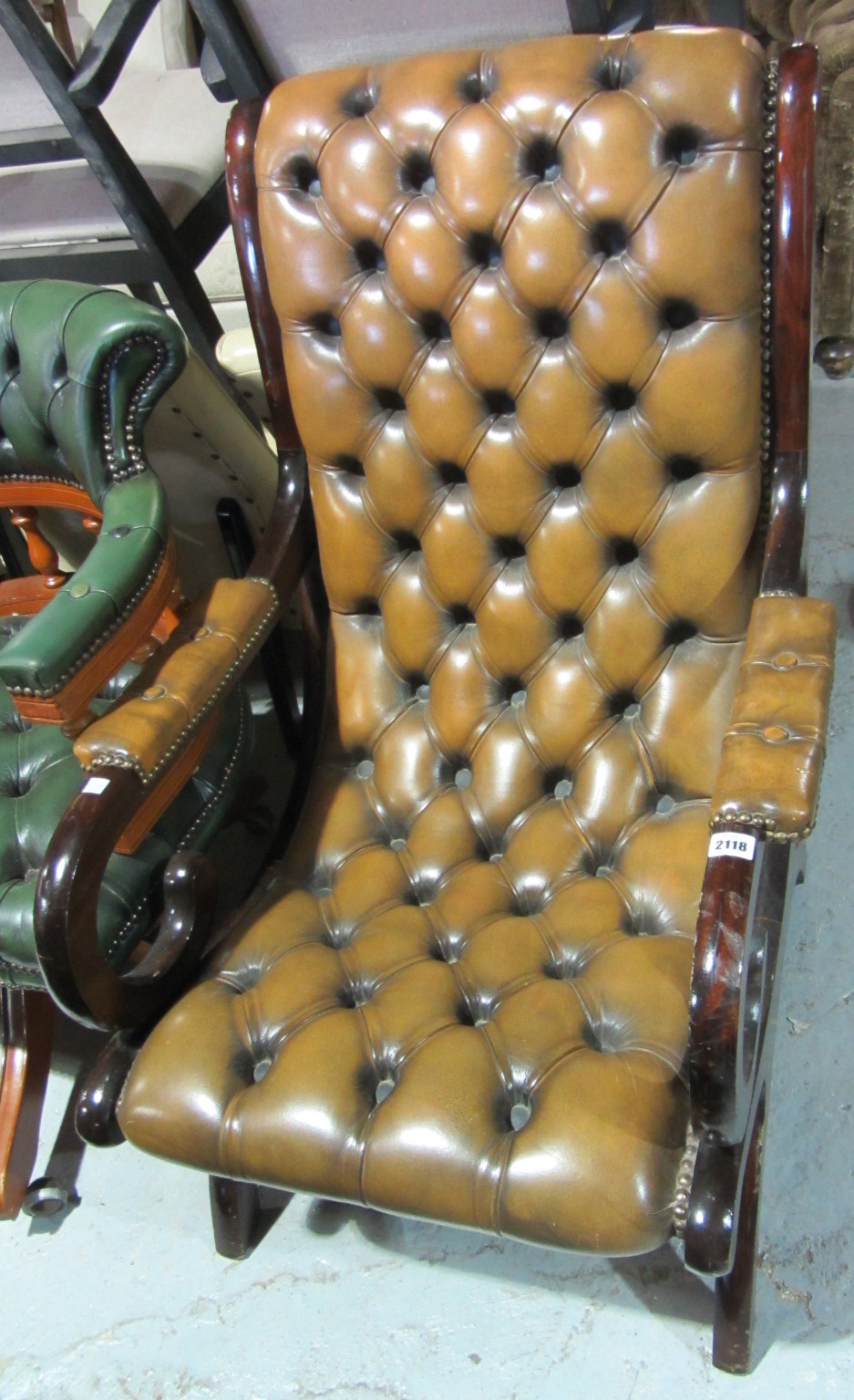 Appraisal: A th century button back leather armchair