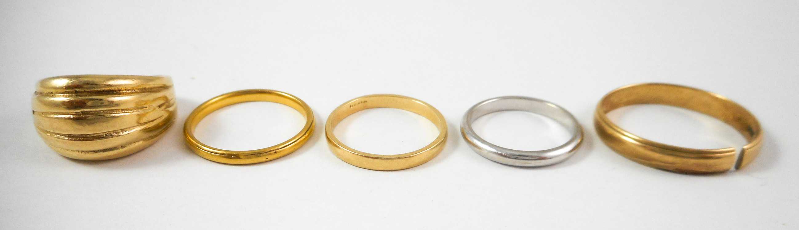 Appraisal: COLLECTION OF FIVE GOLD RINGS including a size - k