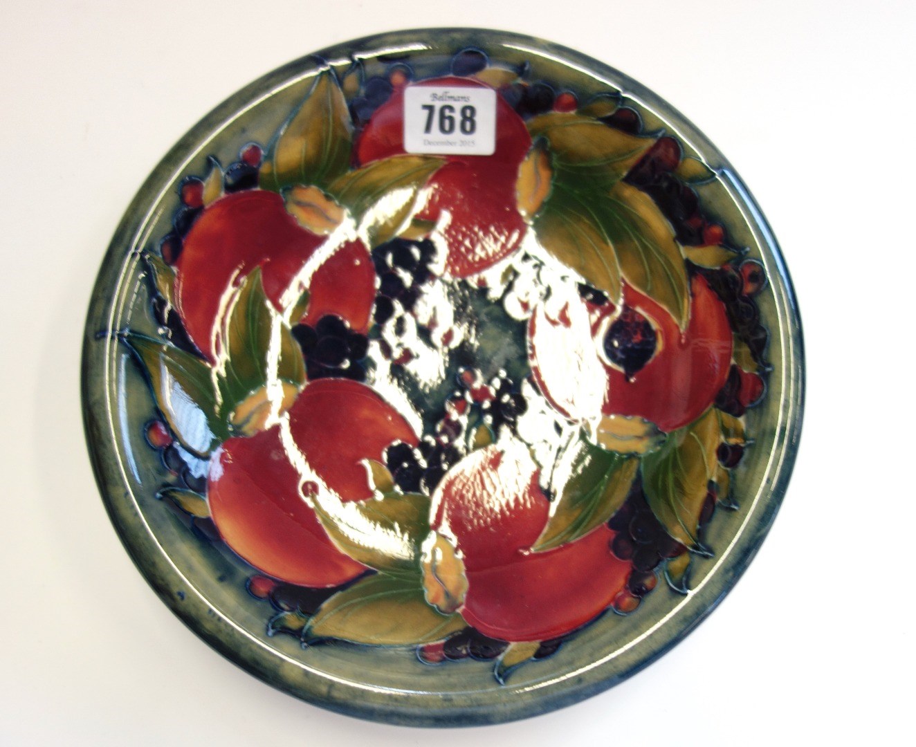 Appraisal: A Moorcroft pottery dish circa decorated in the 'Pomegranate' pattern