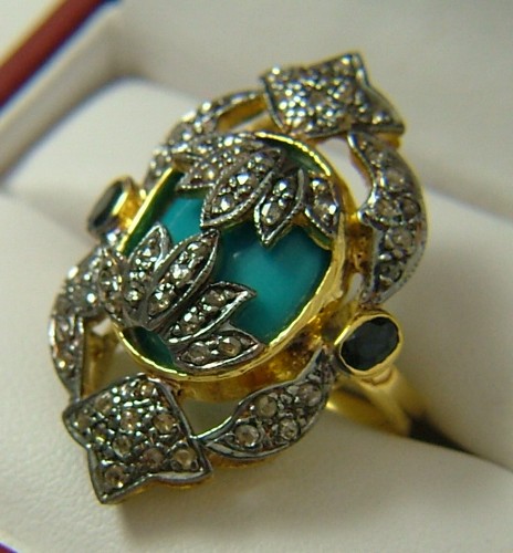 Appraisal: TURQUOISE SAPPHIRE AND CHAMPAGNE DIAMOND RING K yellow and white