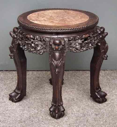 Appraisal: A Chinese rosewood circular jardiniere stand with pink veined marble