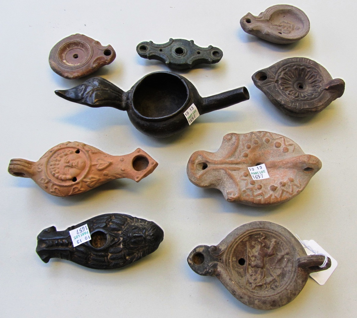 Appraisal: A group of Roman-Early Christian pottery and bronze lamps circa