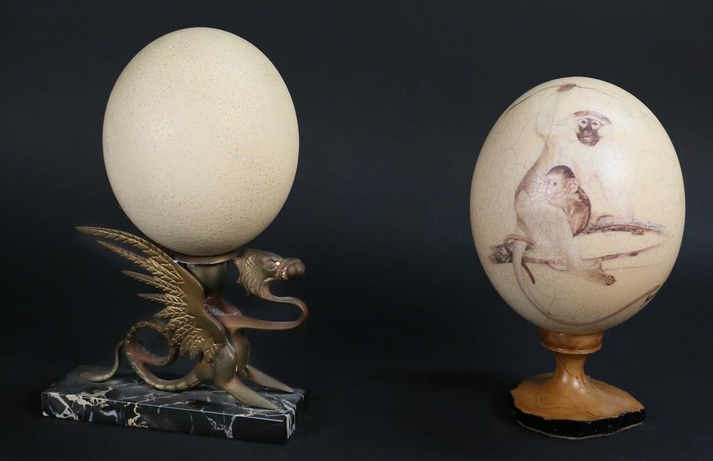 Appraisal: TWO DECORATIVE OSTRICH EGGSTwo decorative ostrich eggs th century Painted