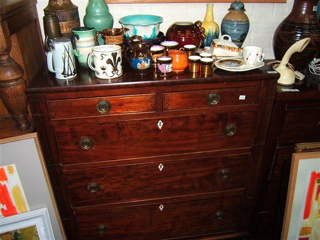 Appraisal: A Victorian mahogany chest of drawers with reeded sides and