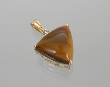 Appraisal: A Tiger Eye and Diamond Pendant k yellow gold pendant