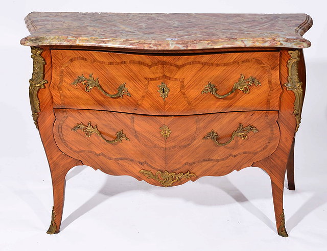 Appraisal: A FRENCH ROCOCO KINGWOOD SERPENTINE COMMODE with striated pink marble