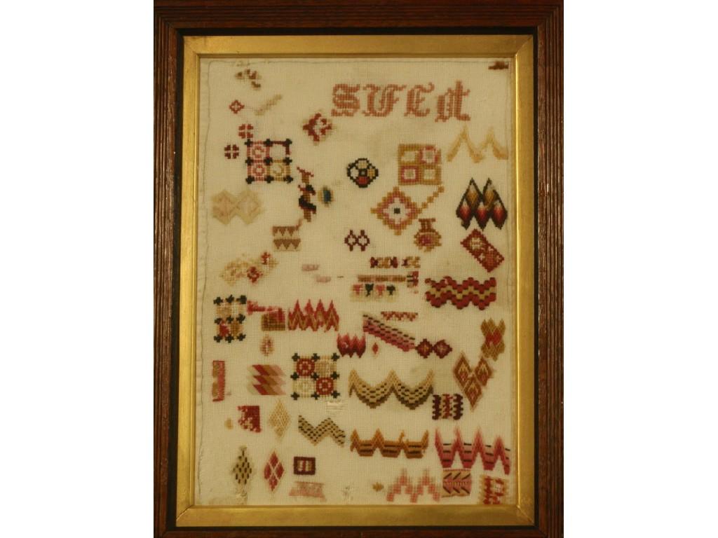 Appraisal: A thC woolwork sampler worked in coloured thread with random