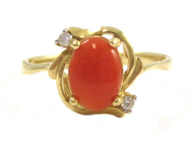 Appraisal: CORAL DIAMOND AND FOURTEEN KARAT GOLD RING with two round-cut