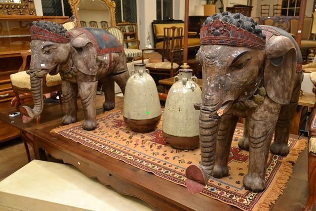 Appraisal: A PAIR OF PAINTED WOODEN RUSTIC ELEPHANTS