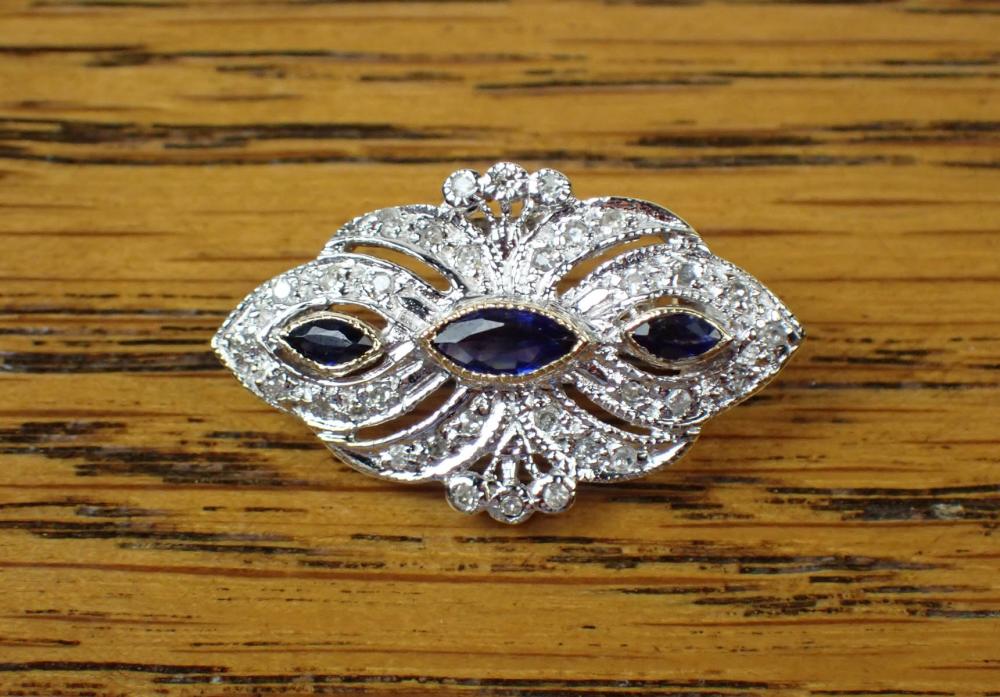 Appraisal: SAPPHIRE DIAMOND AND FOURTEEN KARAT GOLD PIN The k white