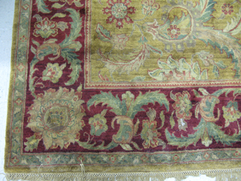 Appraisal: HAND KNOTTED ORIENTAL CARPET Indo-Persian overall foliate design on green