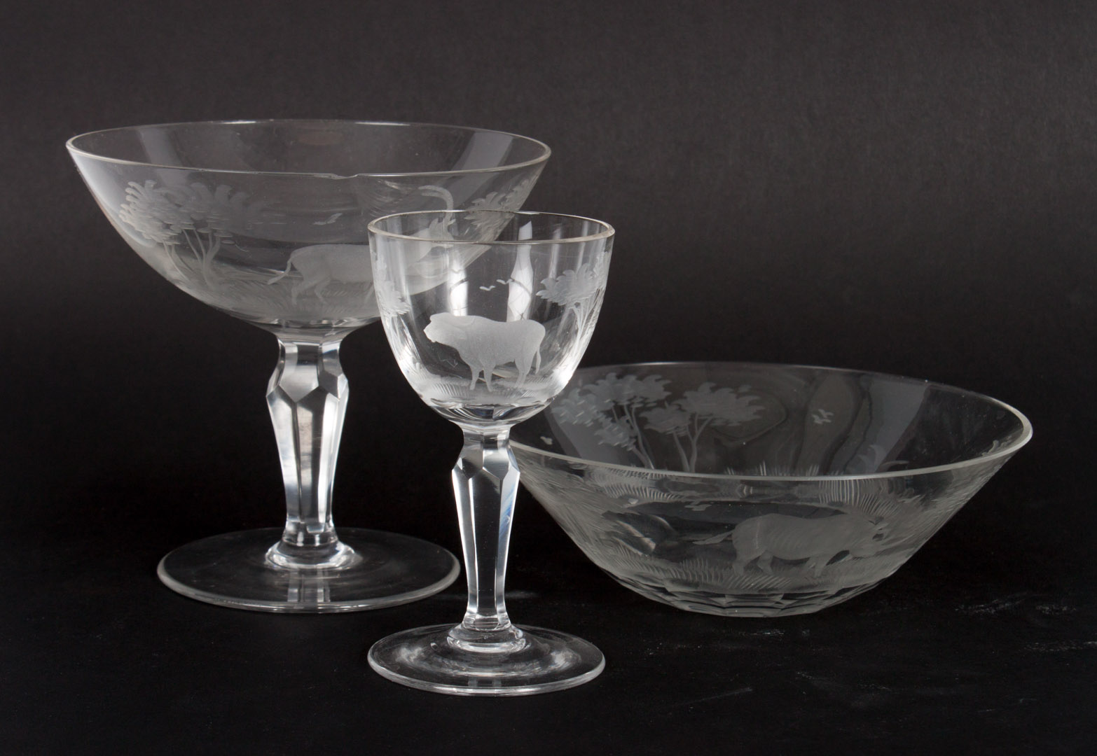 Appraisal: Gerald Webster etched glass stemware pieces in the African Wildlife