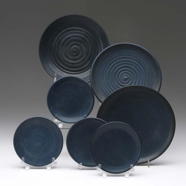 Appraisal: MARBLEHEAD Seven plates covered in a smooth matte blue glaze