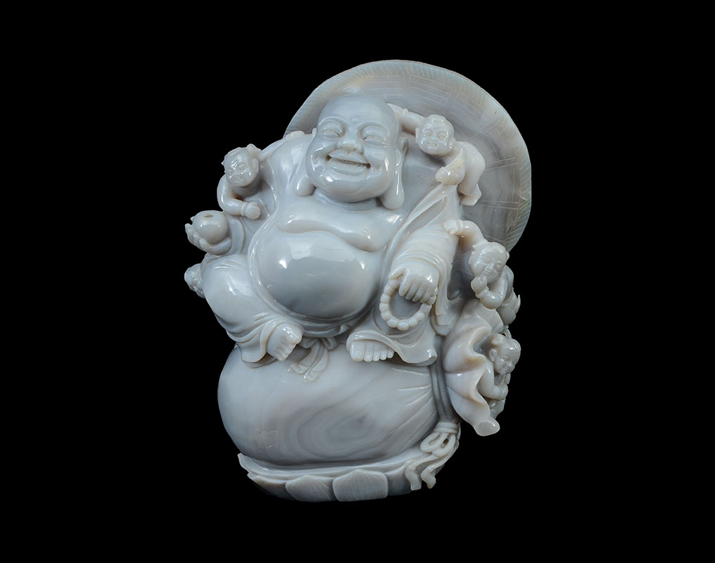 Appraisal: LARGE CARVED LAVENDER AGATE LAUGHING BUDDHA GROUP Chinese carved lavender