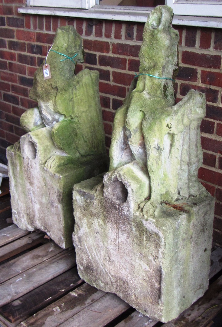 Appraisal: A pair of Victorian carved limestone figures of gargoyles on