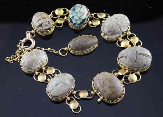 Appraisal: An early th century gold mounted Egyptian scarab bracelet set