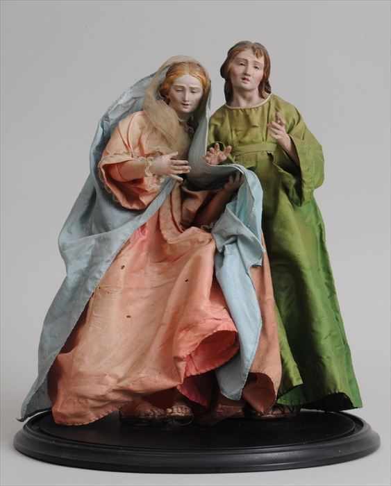 Appraisal: TWO NEAPOLITAN PAINTED WOOD CRECHE FIGURES Each with inset glass